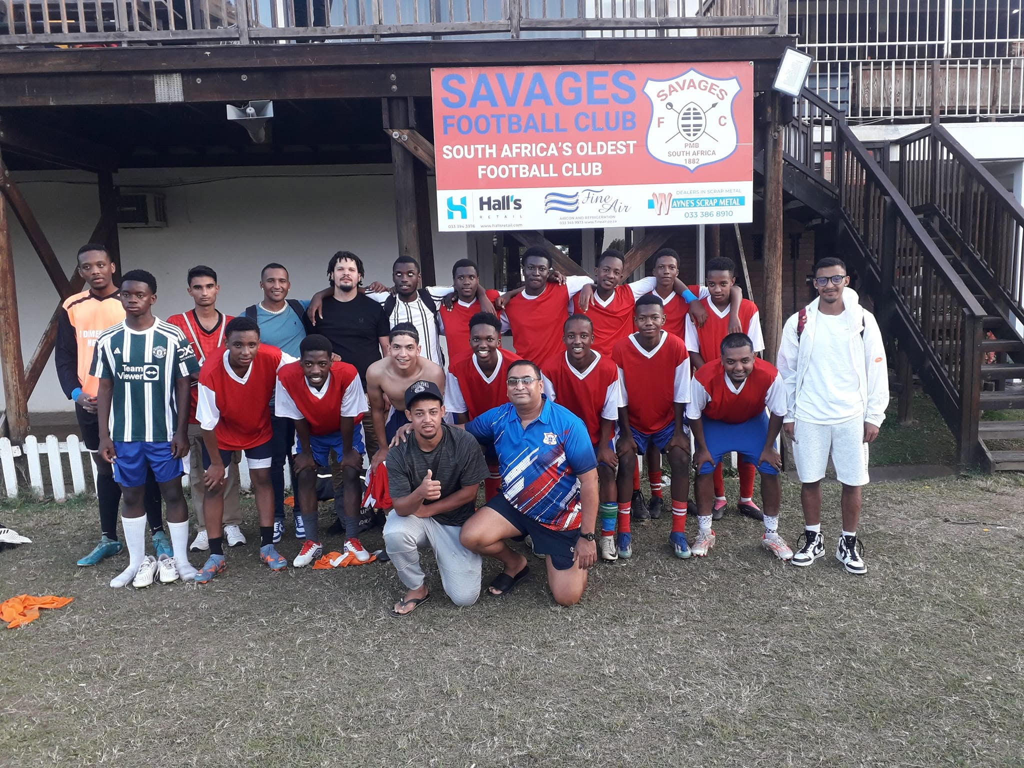 Savages team under the clubhouse sign
